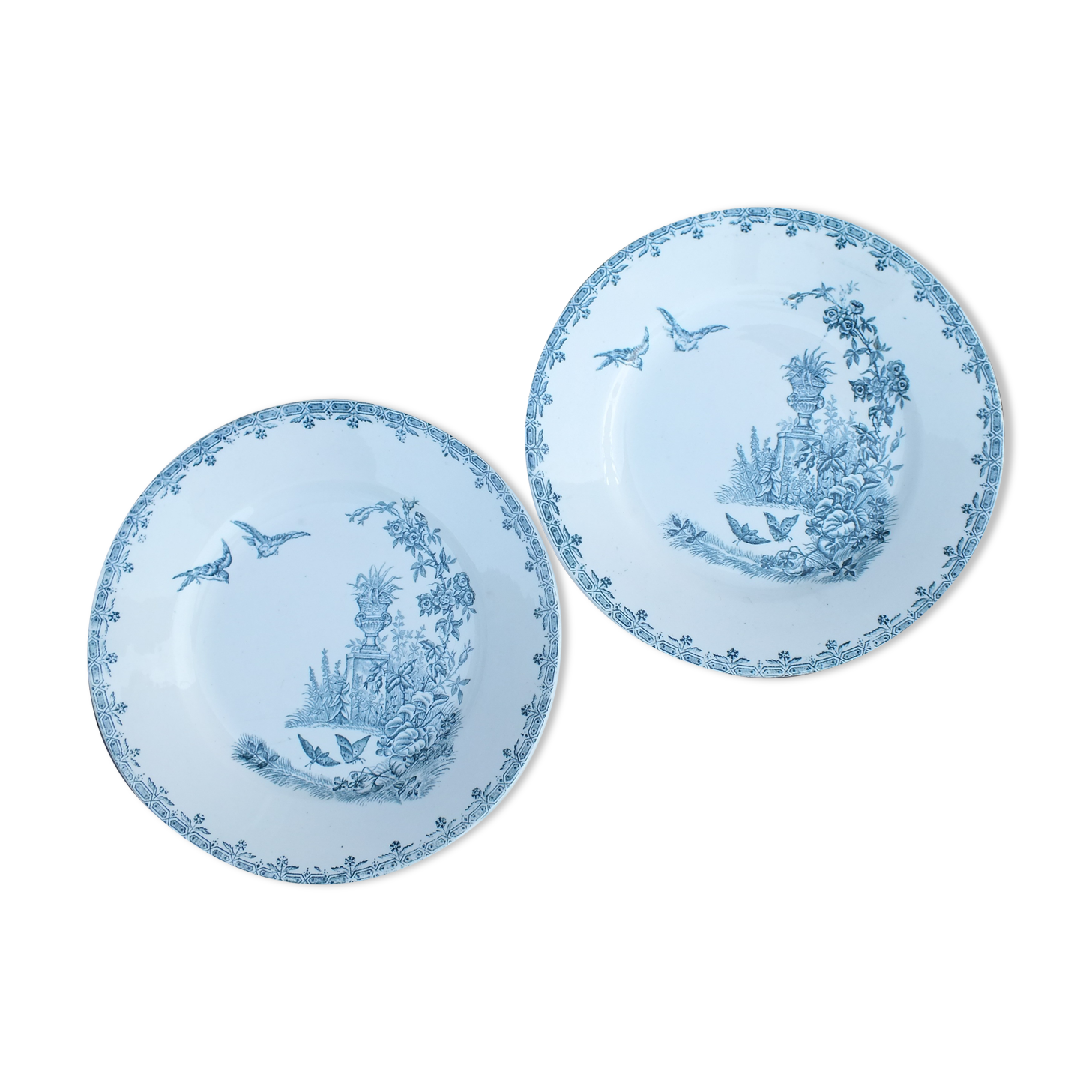 Duo of old plates in Iron Earth decorated with birds and butterflies