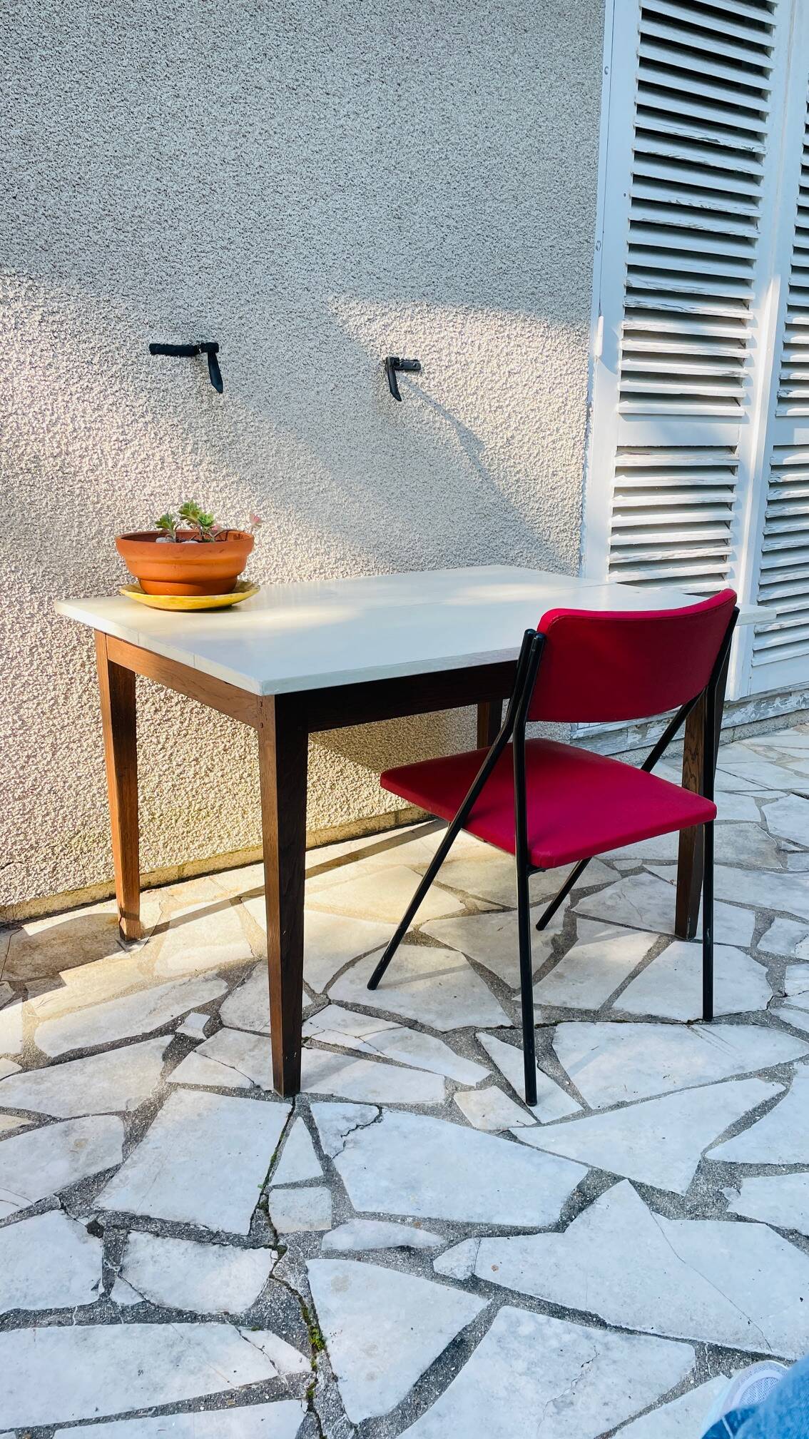 Vintage oak farmhouse table with a white top.