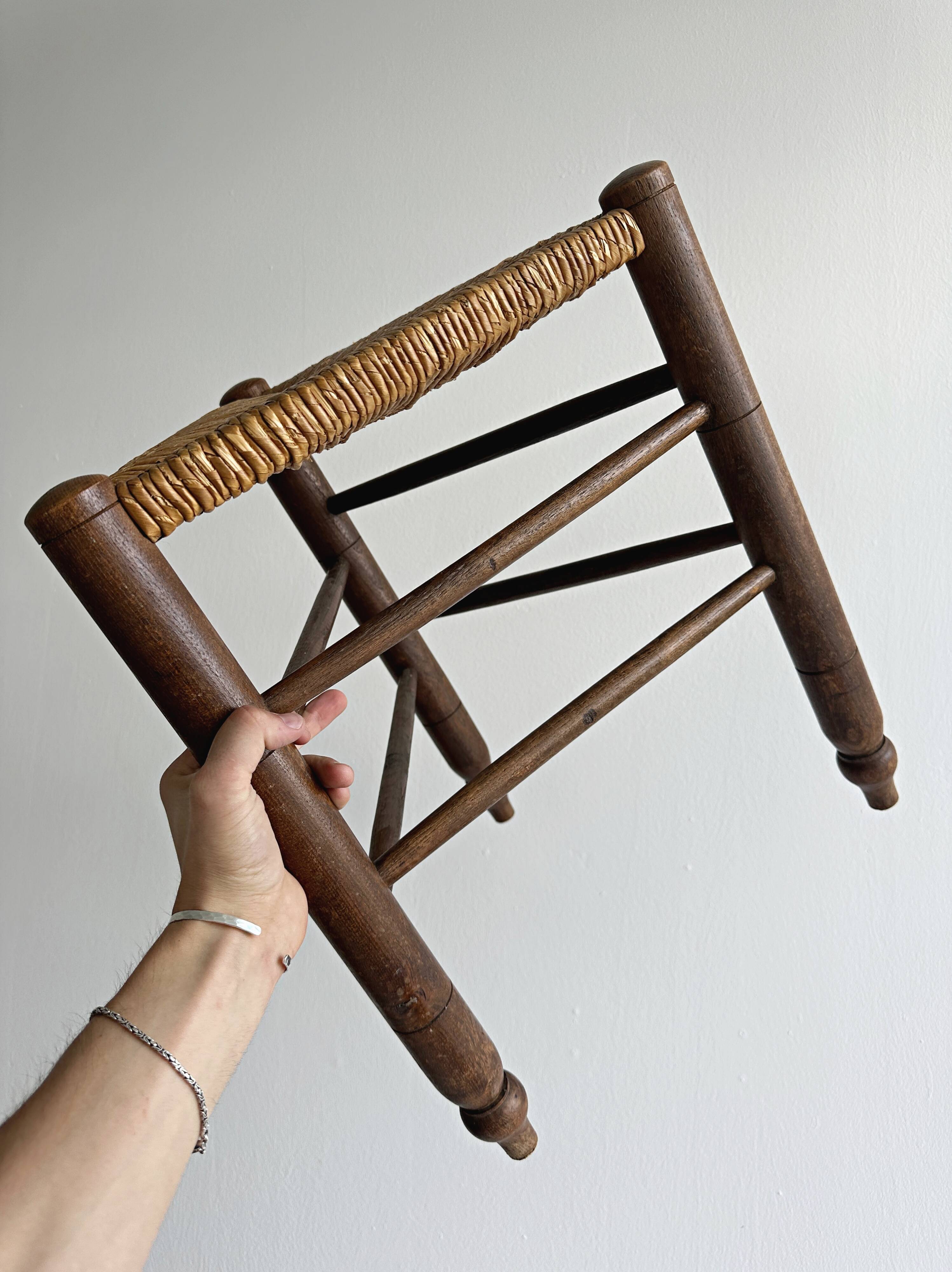 Triangular turned wooden stool
