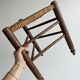 Triangular turned wooden stool