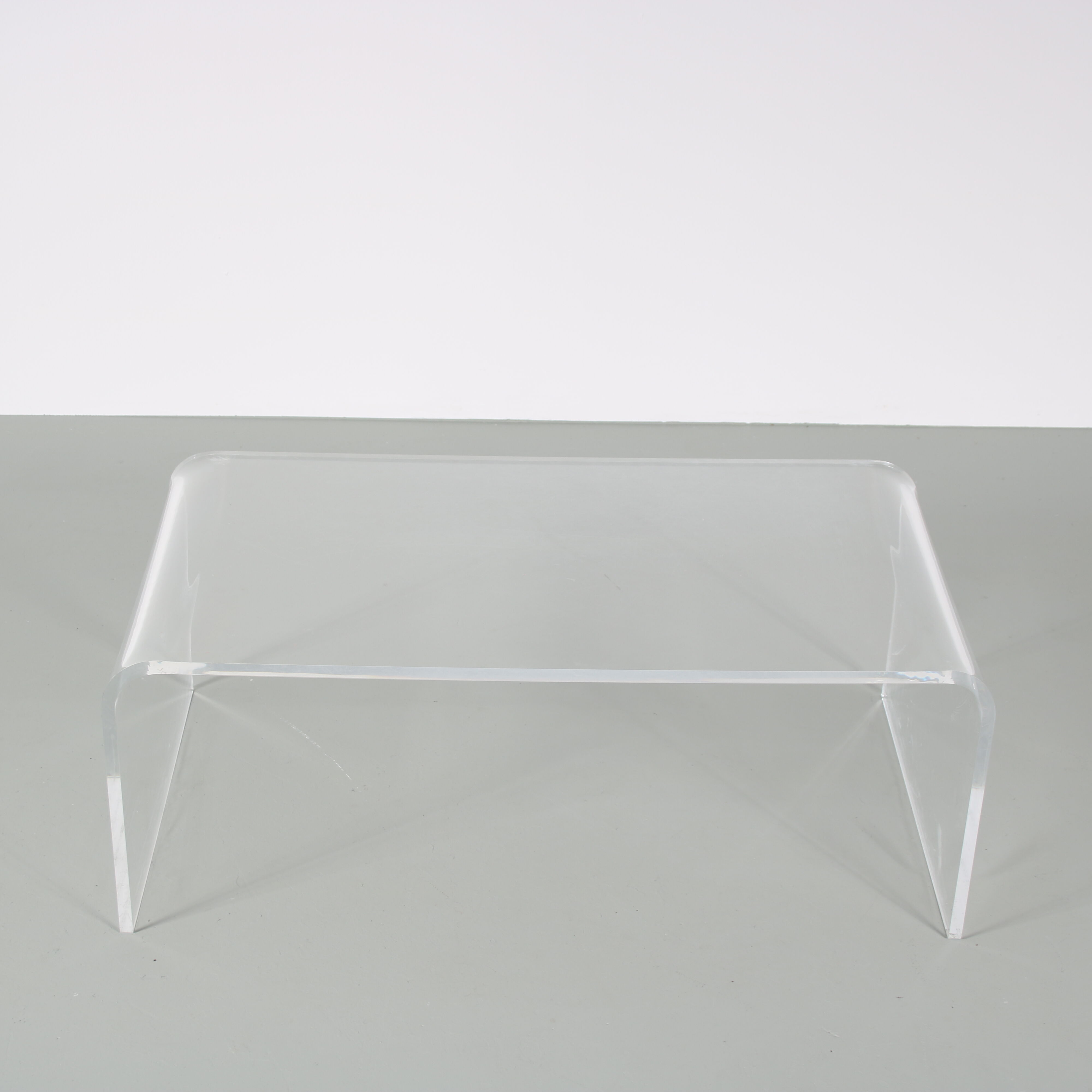 1970s Bent plexiglass coffee table from France
