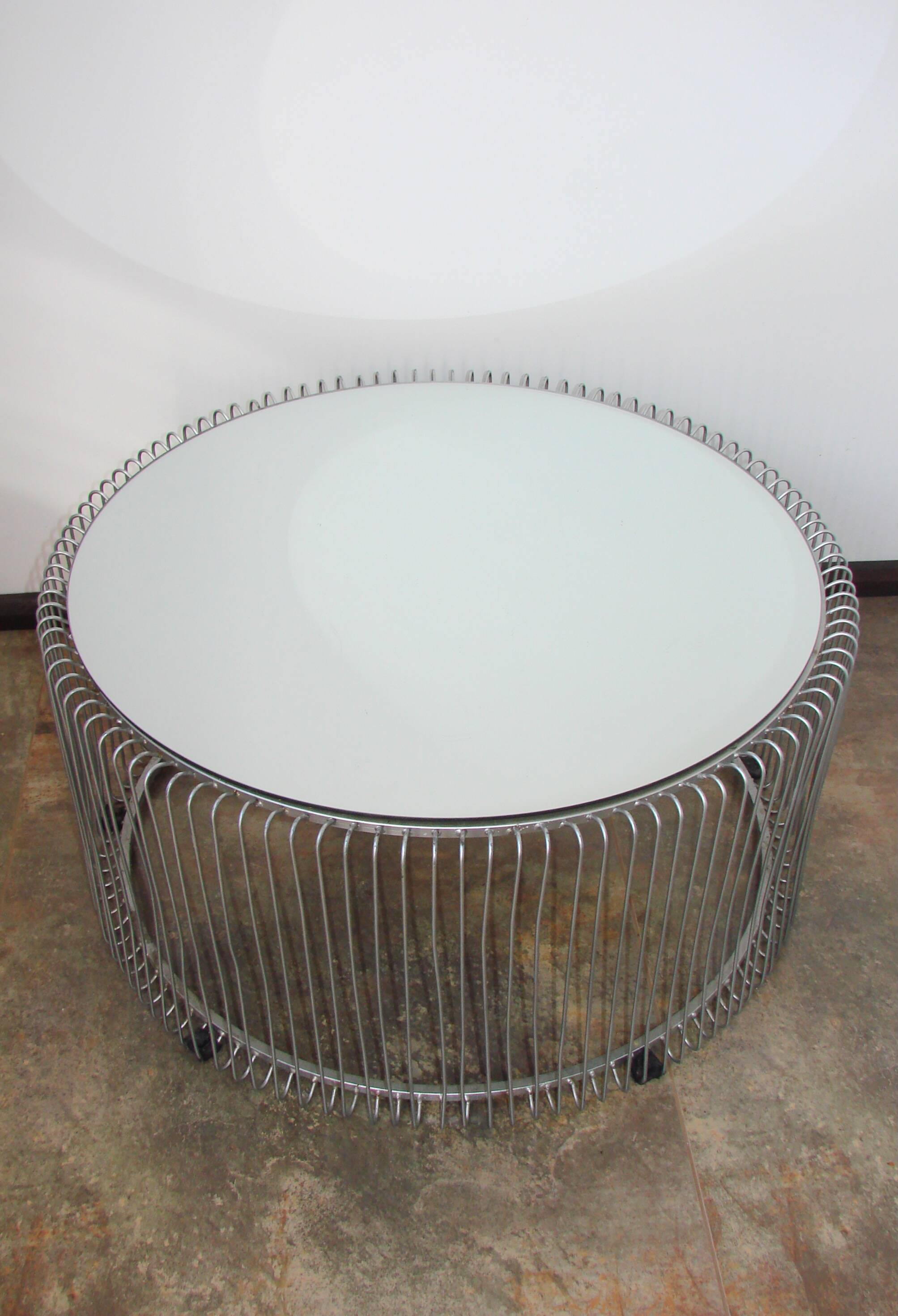 A round coffee table with a mirrored top, from the 1990s.
