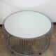 A round coffee table with a mirrored top, from the 1990s.