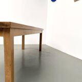 Solid oak farmhouse table, square legs.