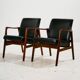 Teak armchair with leather upholstery
