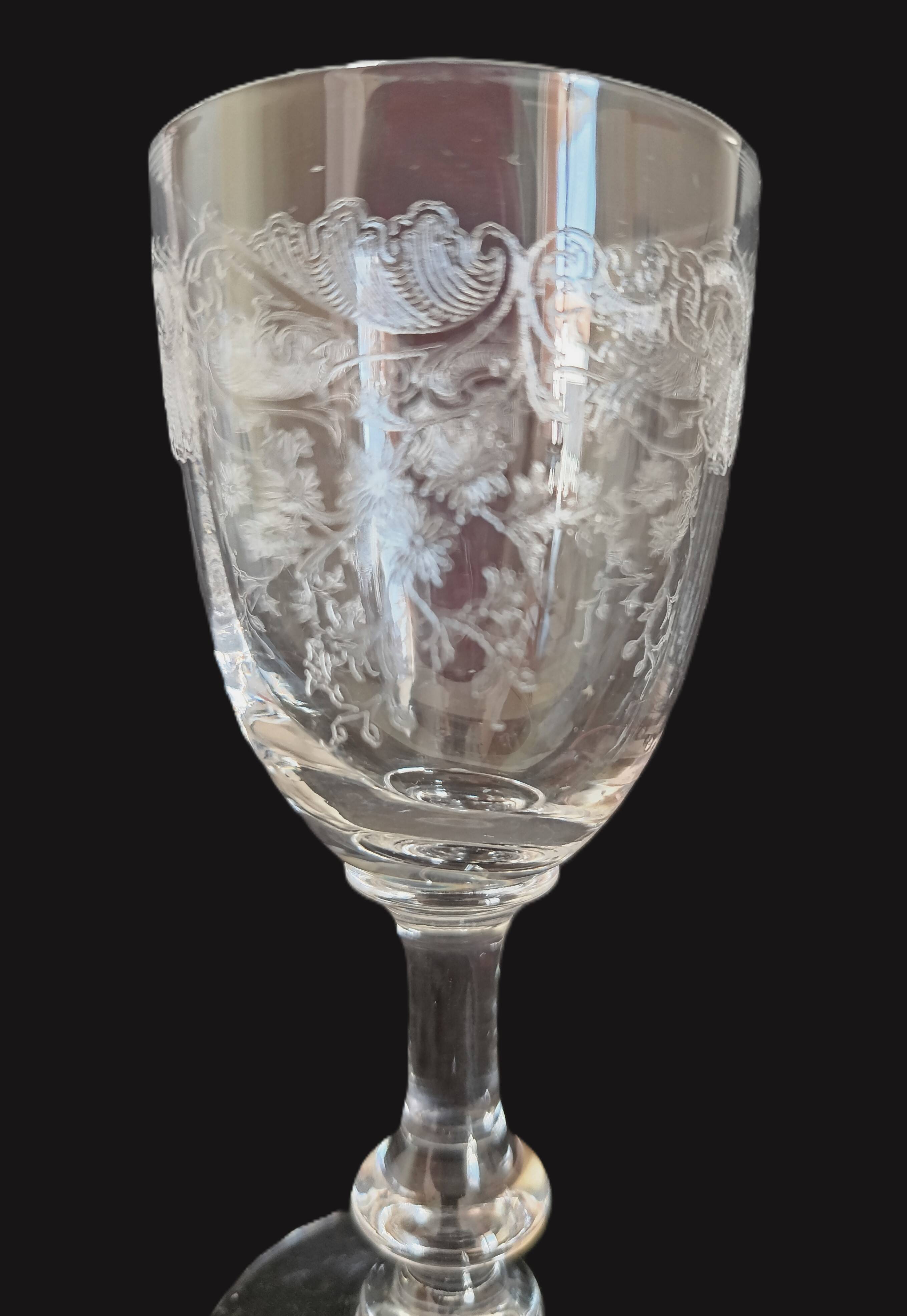 9 crystal white wine glasses from St. Louis model Cléo and their decanter.