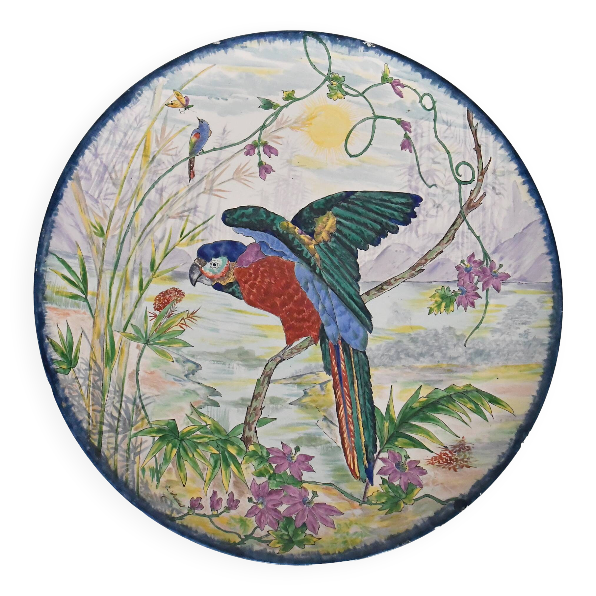 Large earthenware dish decorated with a parrot.