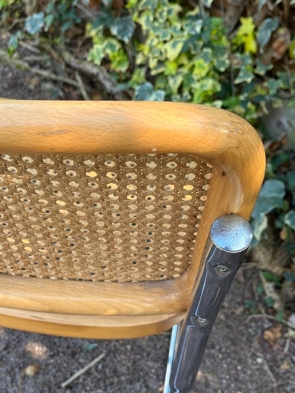 Wooden chair with caning in the style of Marcel Breuer.
