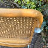 Wooden chair with caning in the style of Marcel Breuer.