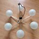 Six-light chrome metal chandelier and opaque glass globes / vintage 60s and 70s