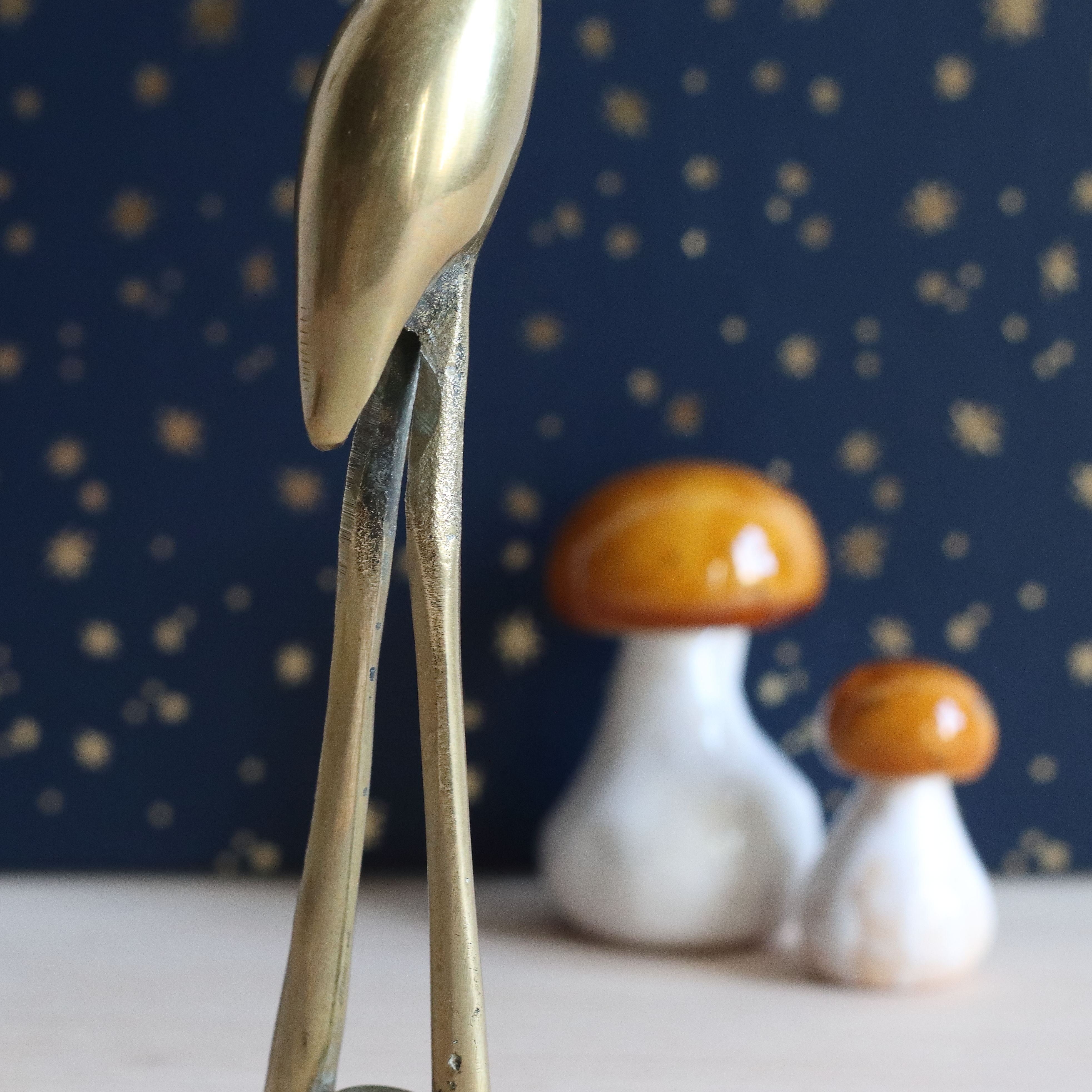 Couple of herons, golden brass