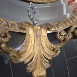 Miroir ovale en bois doré