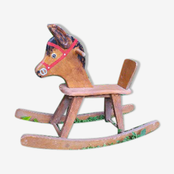 Brown painted wooden rocking horse