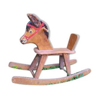 Brown painted wooden rocking horse