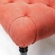 Napoleon III salon armchair in brick red linen with a tufted footrest.