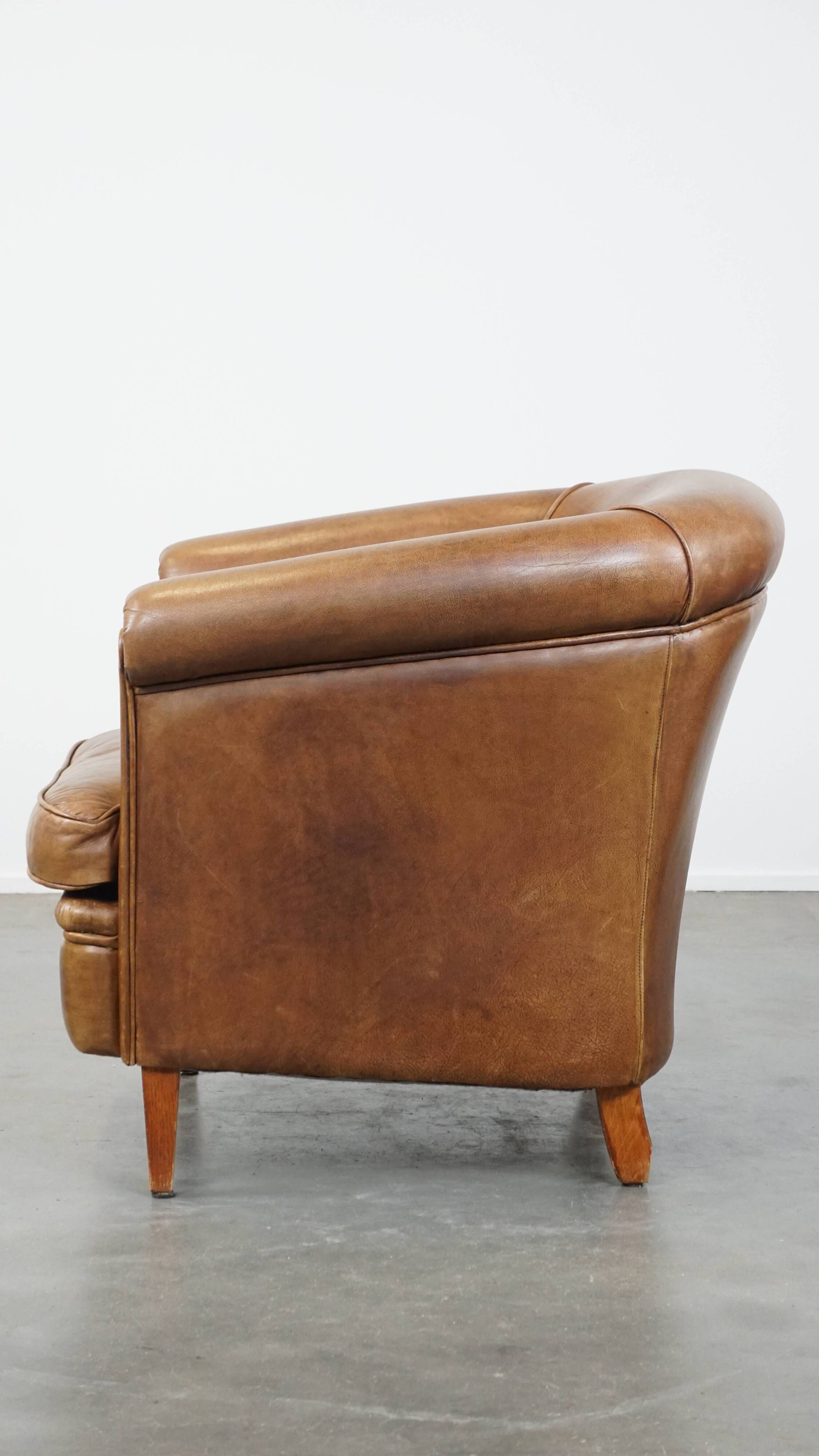 Fauteuil club en cuir de vachette couleur cognac clair