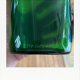 Emerald green glass bottle