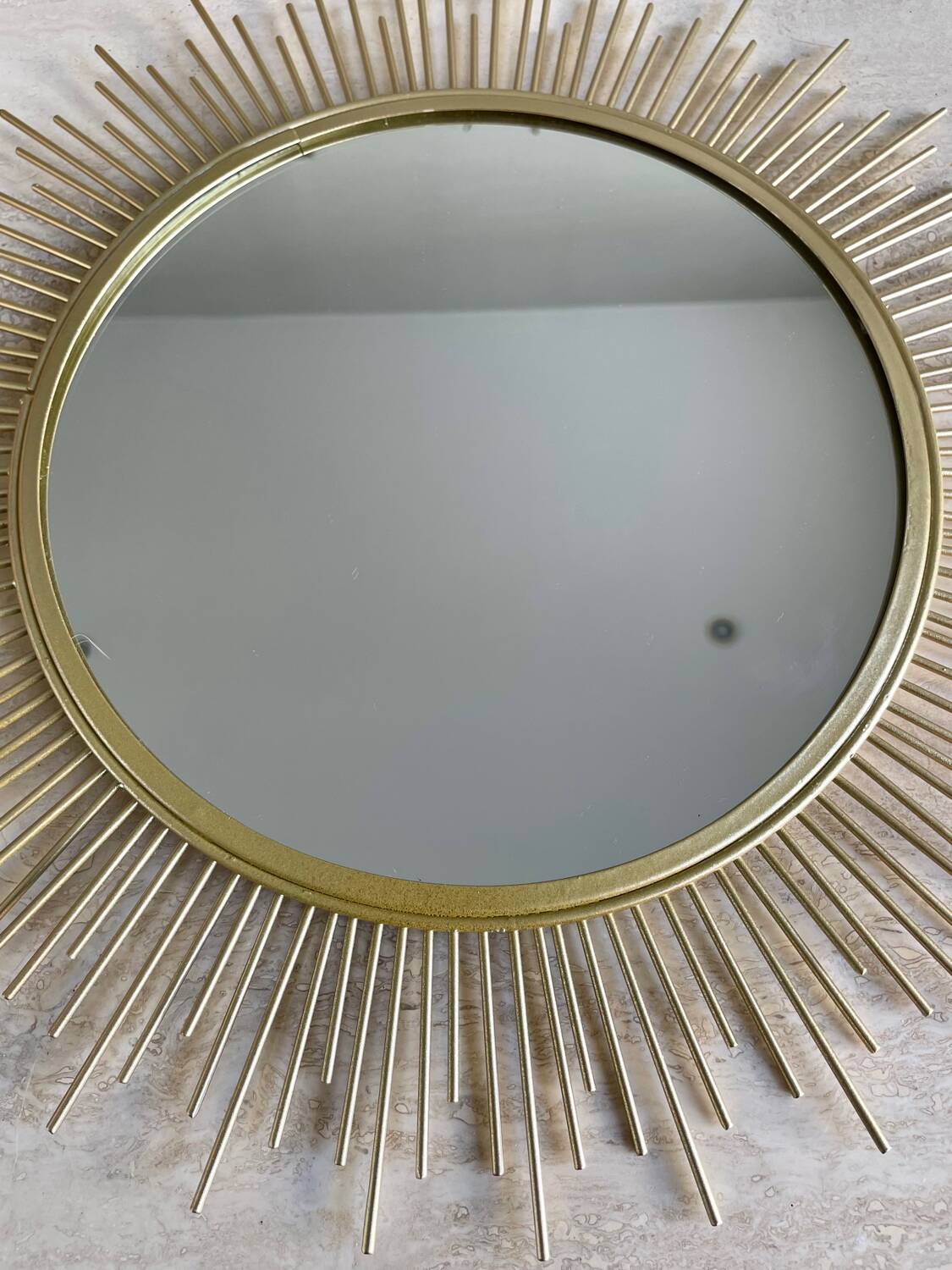 Miroir soleil métal doré