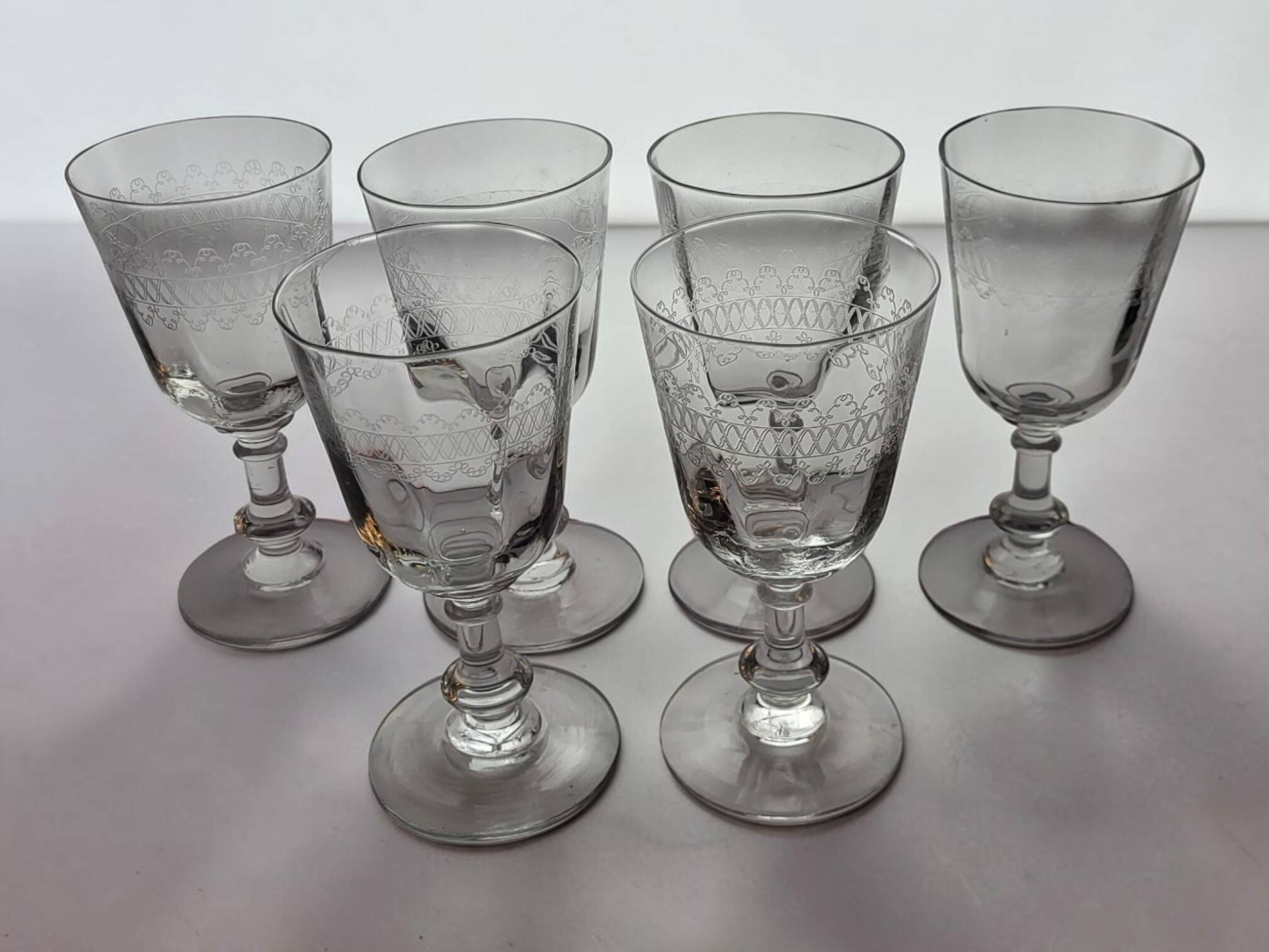 6 engraved glass wine/water glasses from the early 20th century.