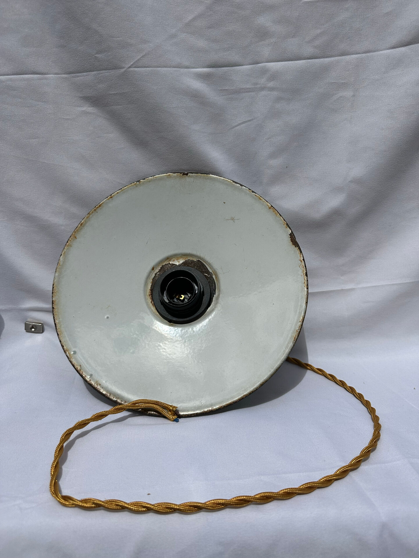 Old green and white enamelled sheet metal suspension
