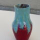 An emailed ceramic vase in turquoise and red, design and vintage
