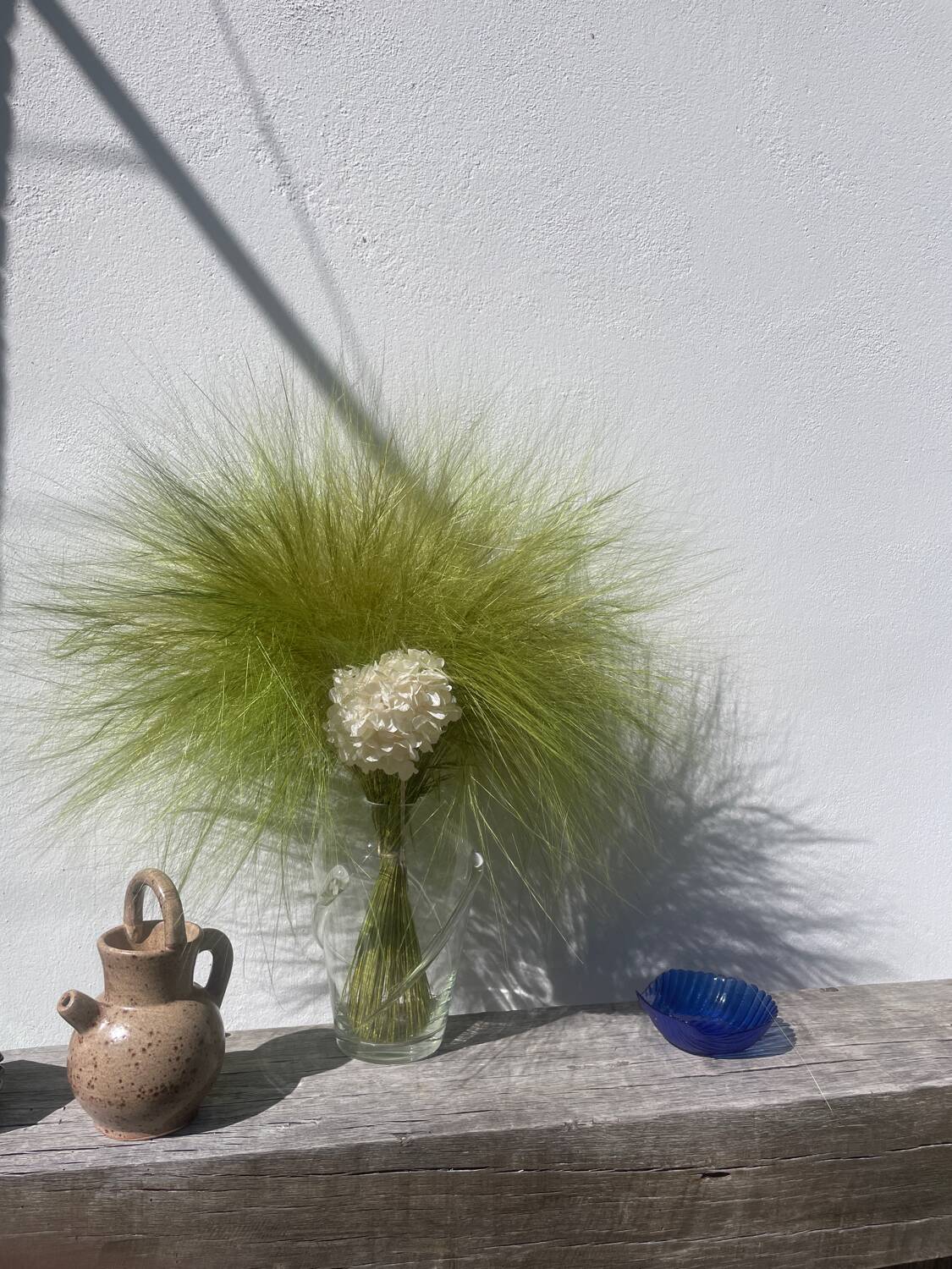 Blue glass shell emptier