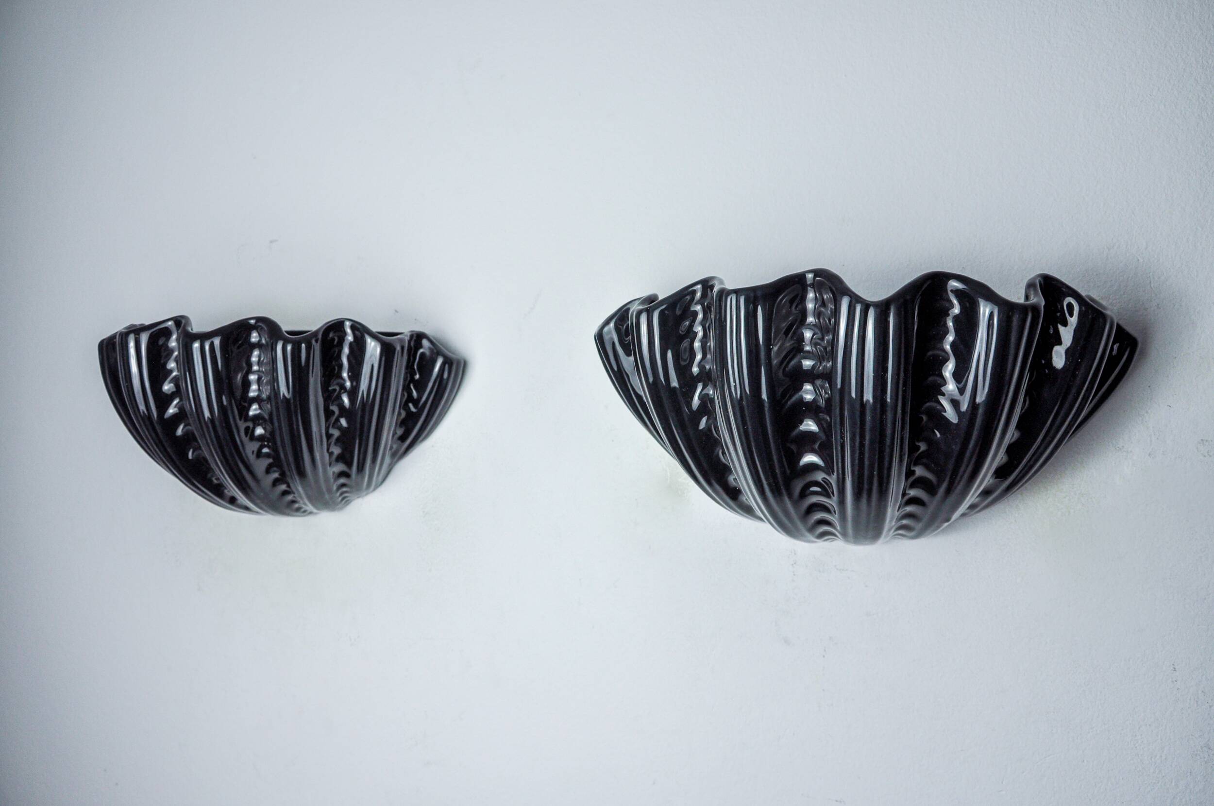 Pair of shell wall lights, black ceramic, Italy, 1970