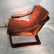 Duo of ochre leather and wood frame armchairs