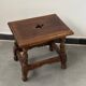 Small antique wooden stool with an openwork pattern.