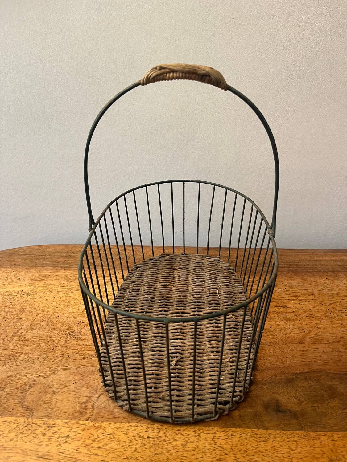 Small wicker and green metal basket
