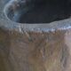 Carved antique tree stump coffee table with circular glass top