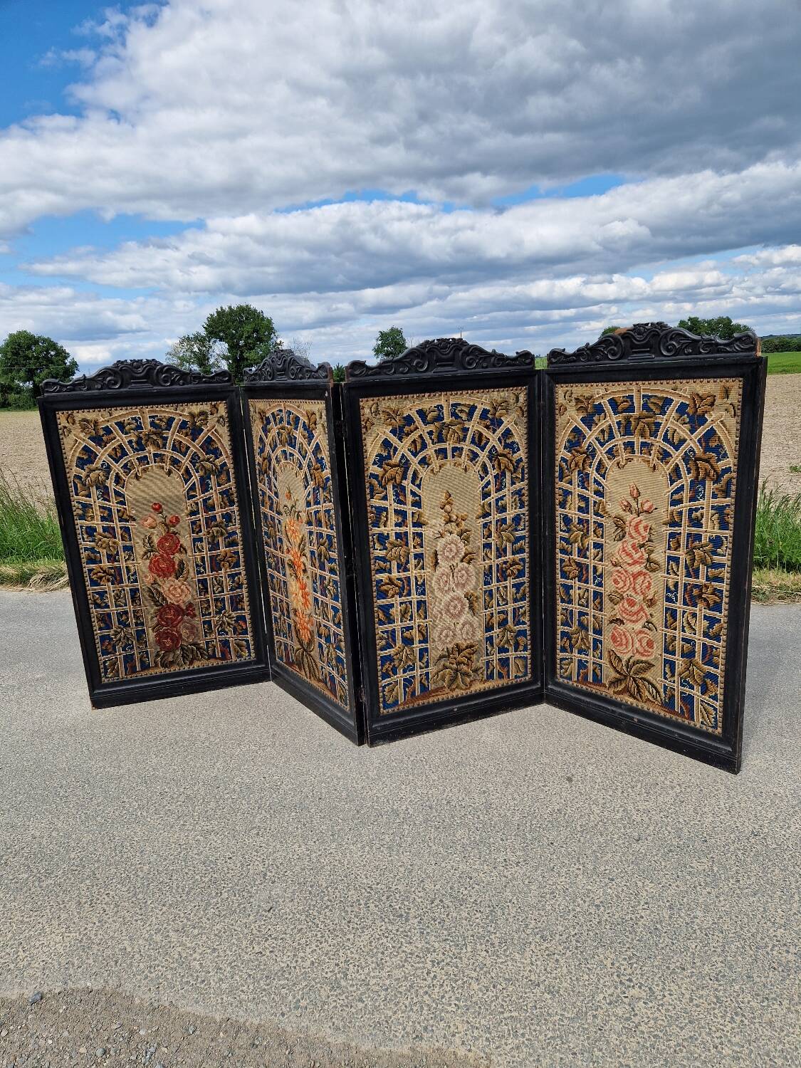 Folding screen in black-painted wood, 19th century