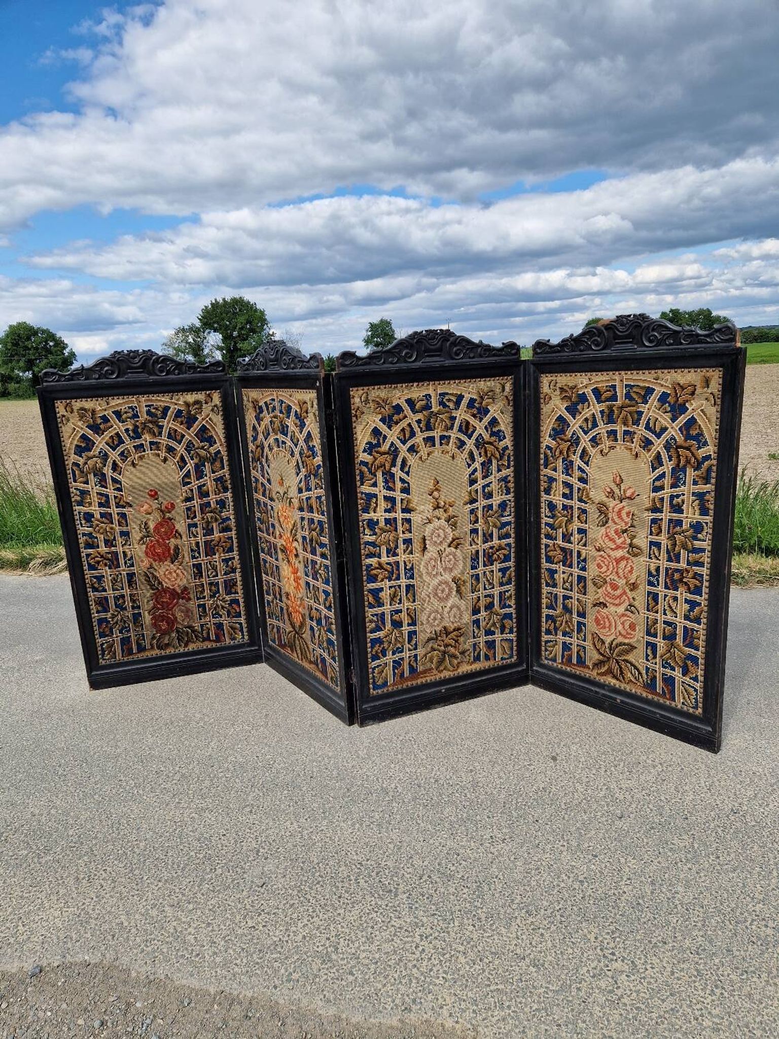 Folding screen in black-painted wood, 19th century