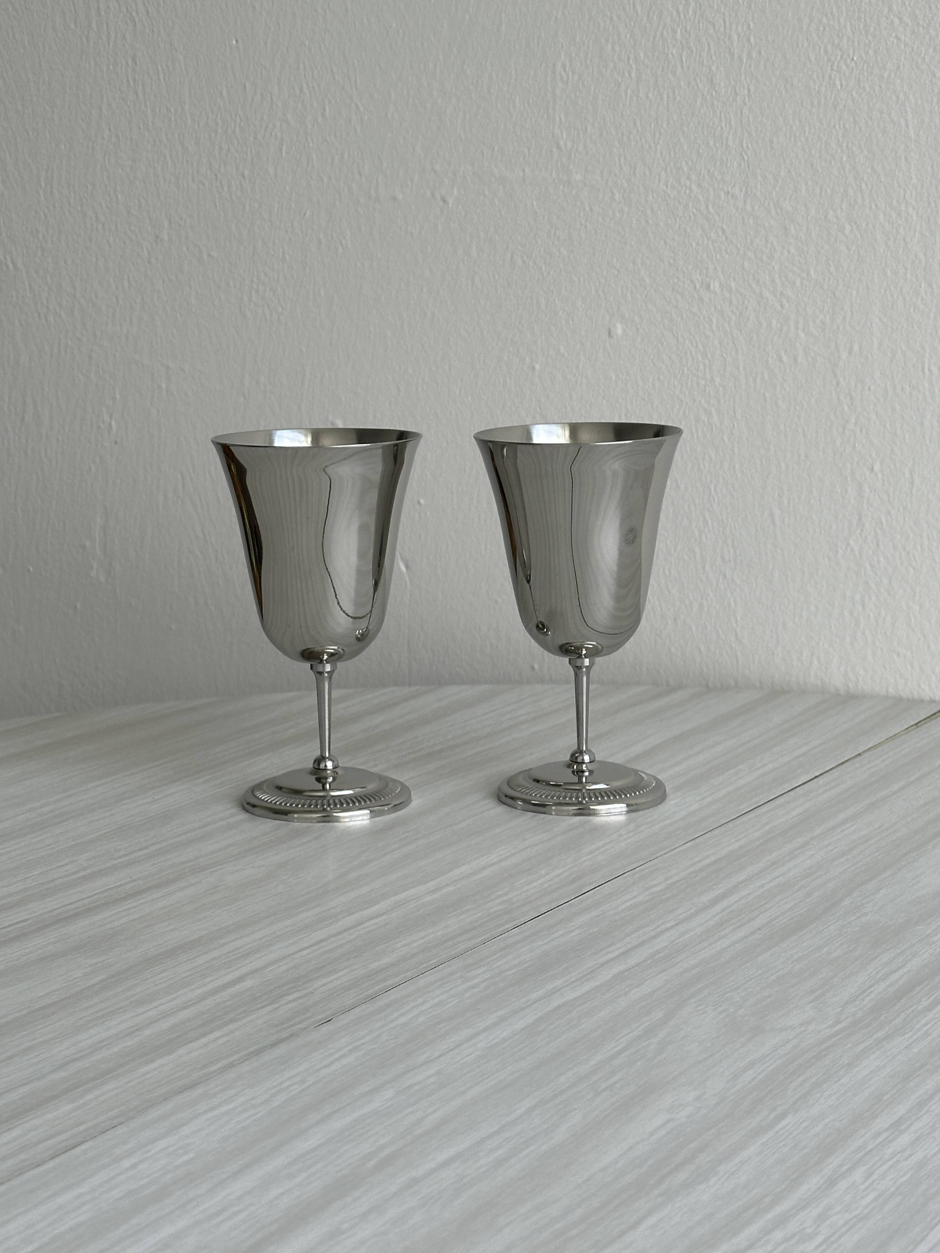 Two metal cups