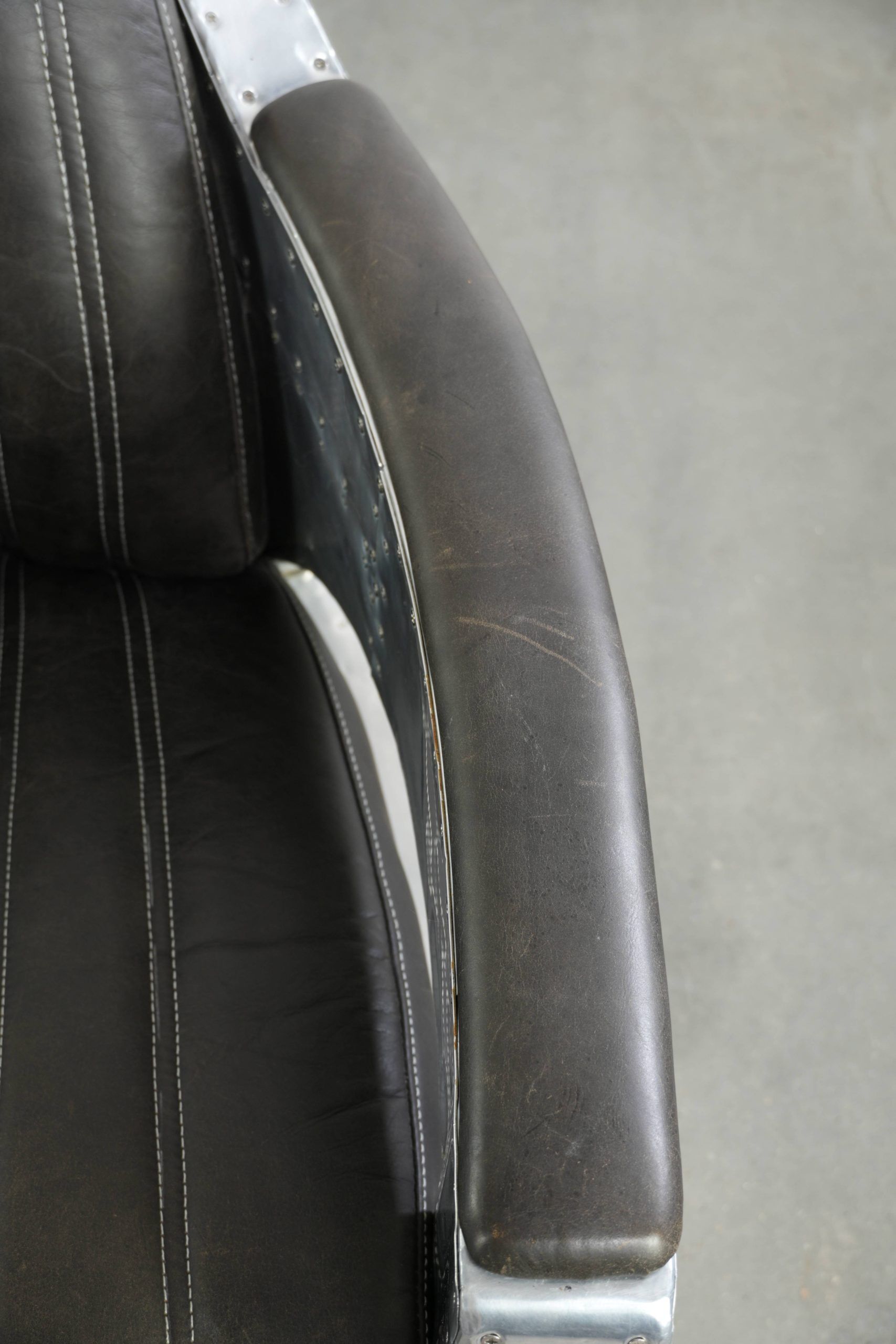 Set of 2 sturdy industrial black cowhide Aviator design armchairs with aluminium and rivets