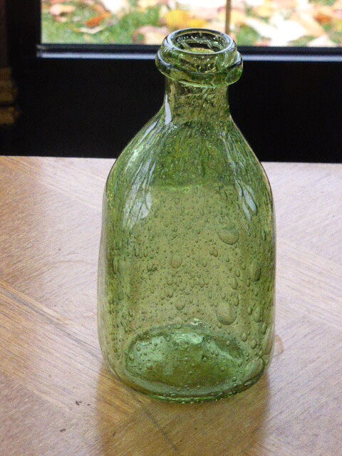 Biot stamped blown glass bottle