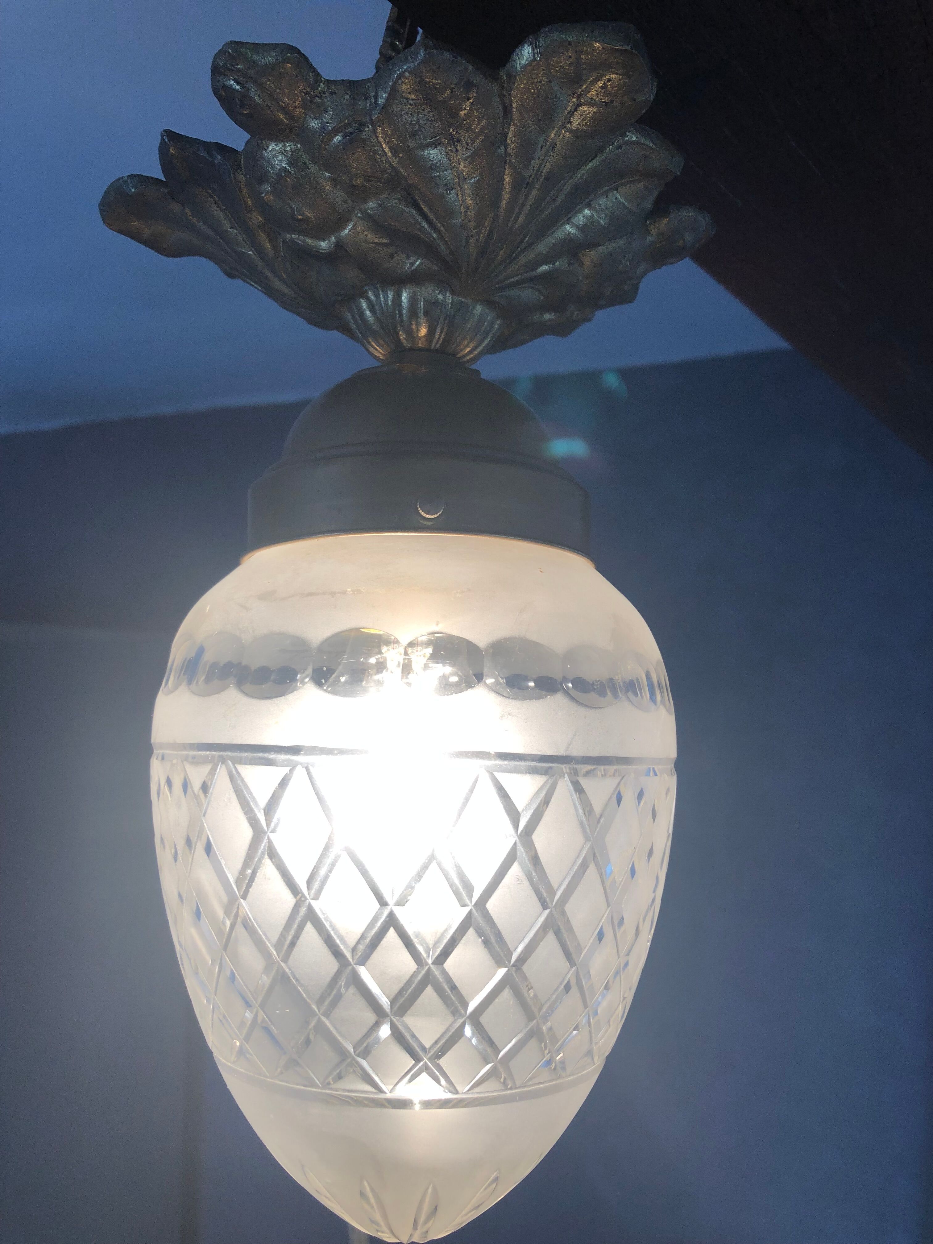 Bronze ceiling lamp and glassware