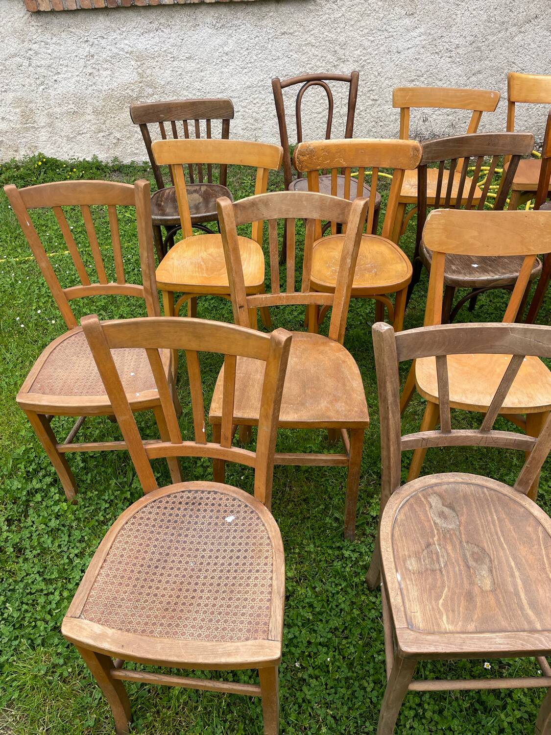 Lot of 16 mismatched bistro chairs