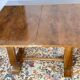 Table époque art déco à plateau ouvrant loupe de noyer