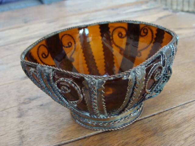 Small glass cup in metal frame