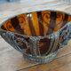 Small glass cup in metal frame