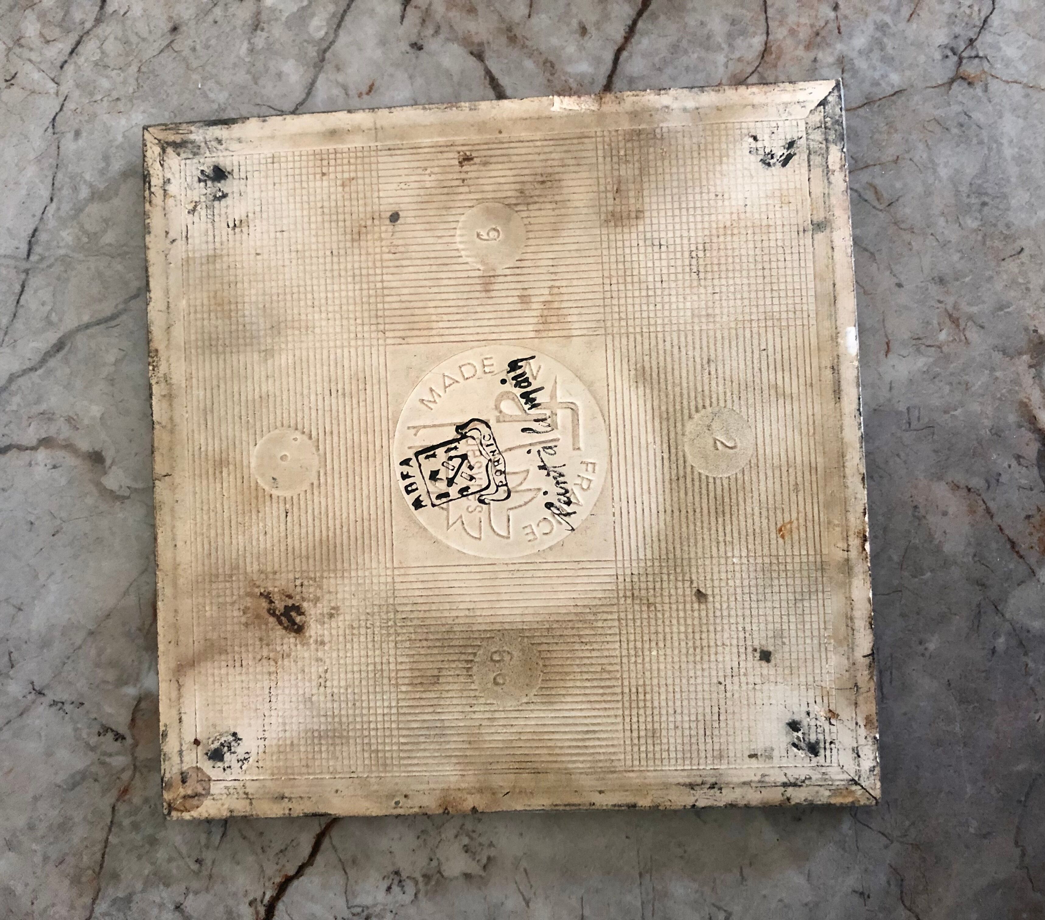 Matching biscuit earthenware dish and tile