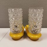 Bathroom lamps in a nice yellow colour with a crystal glass shade and a base of hard thin plastic