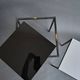 Pair of modernist nesting tables in black metal and white and black opaline 1960.