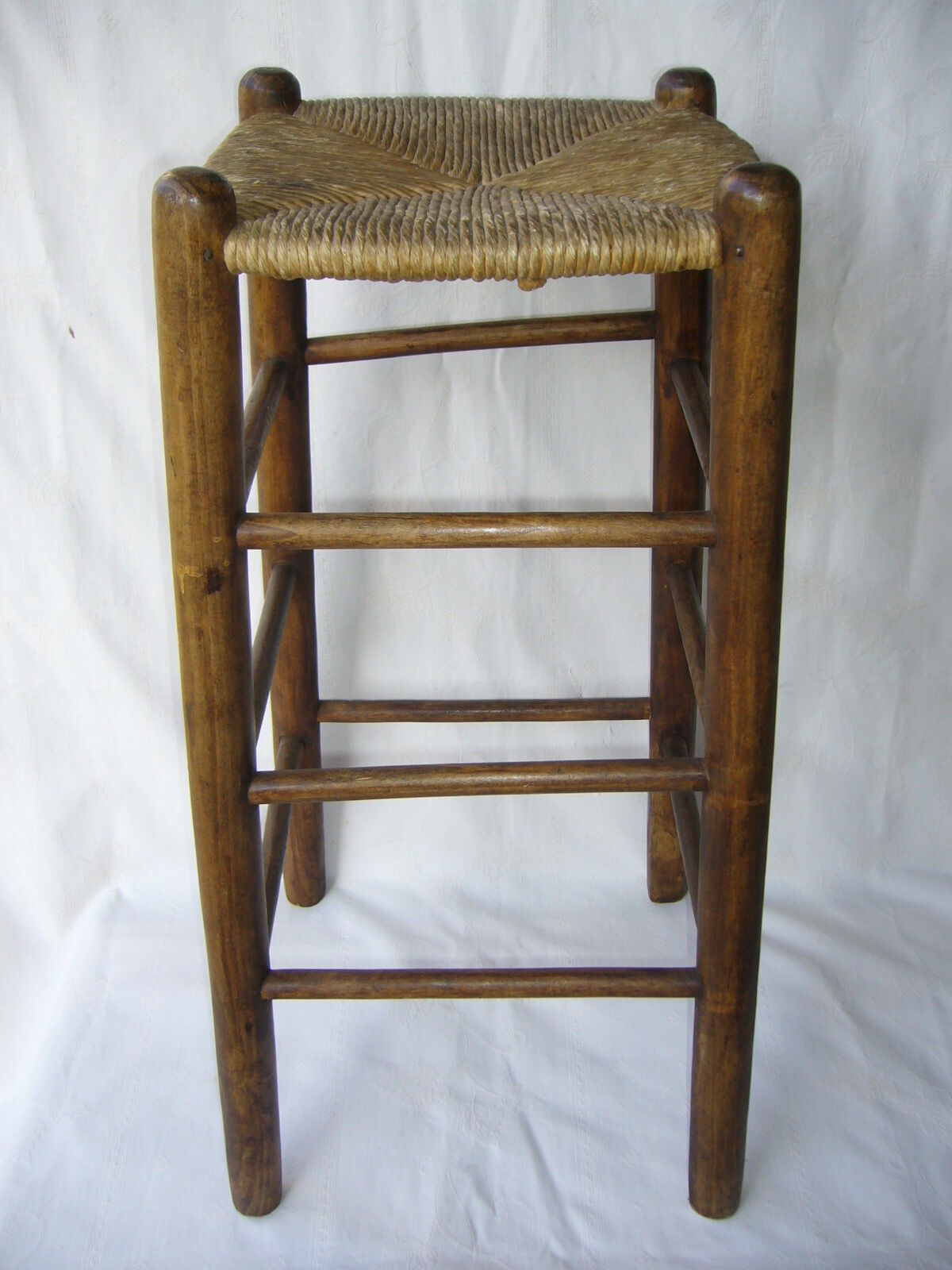 Ancient wooden and straw stool