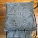 Blue crocheted bedspread and its vintage cushion