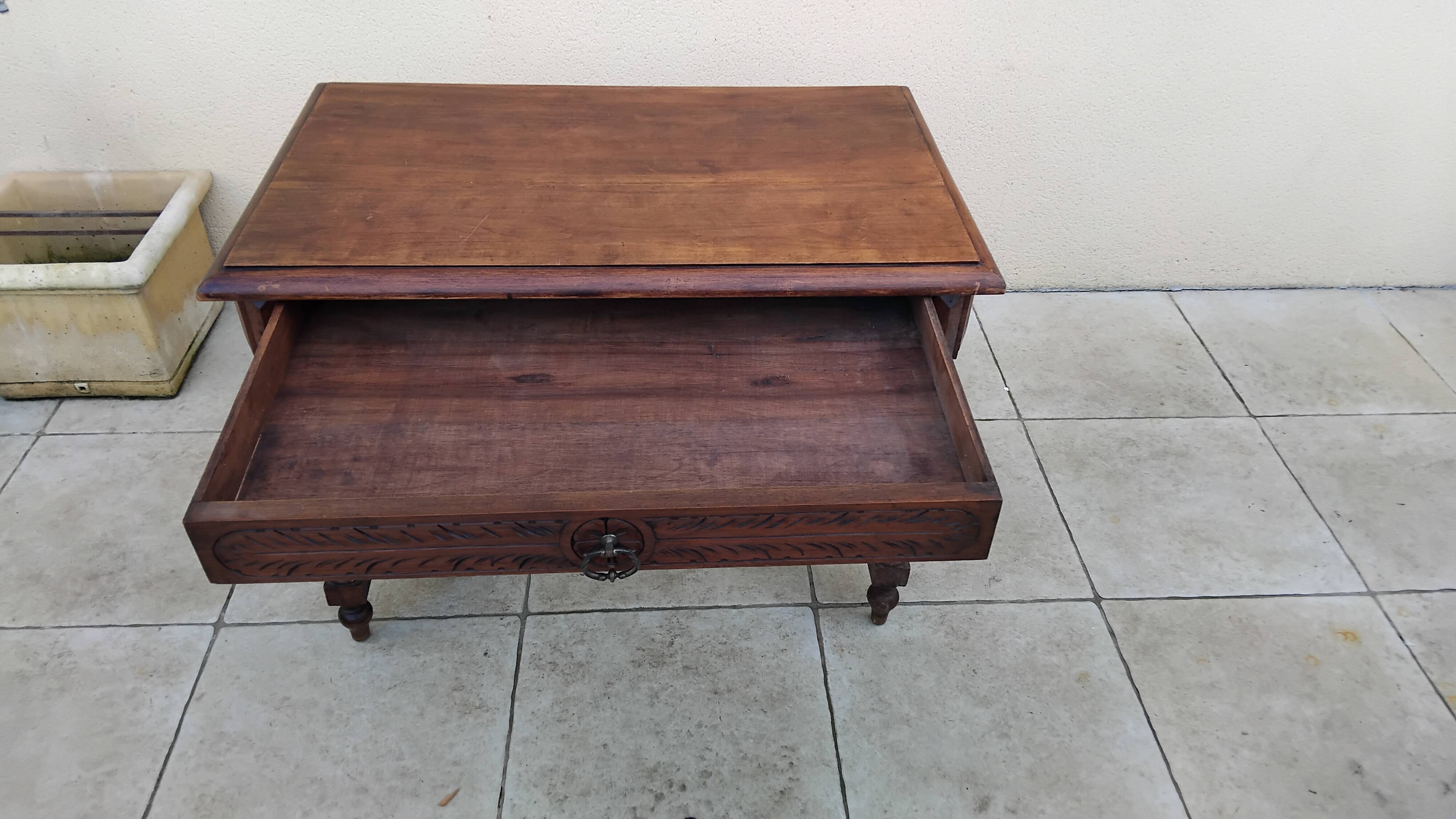 Antique desk or small table in solid carved wood