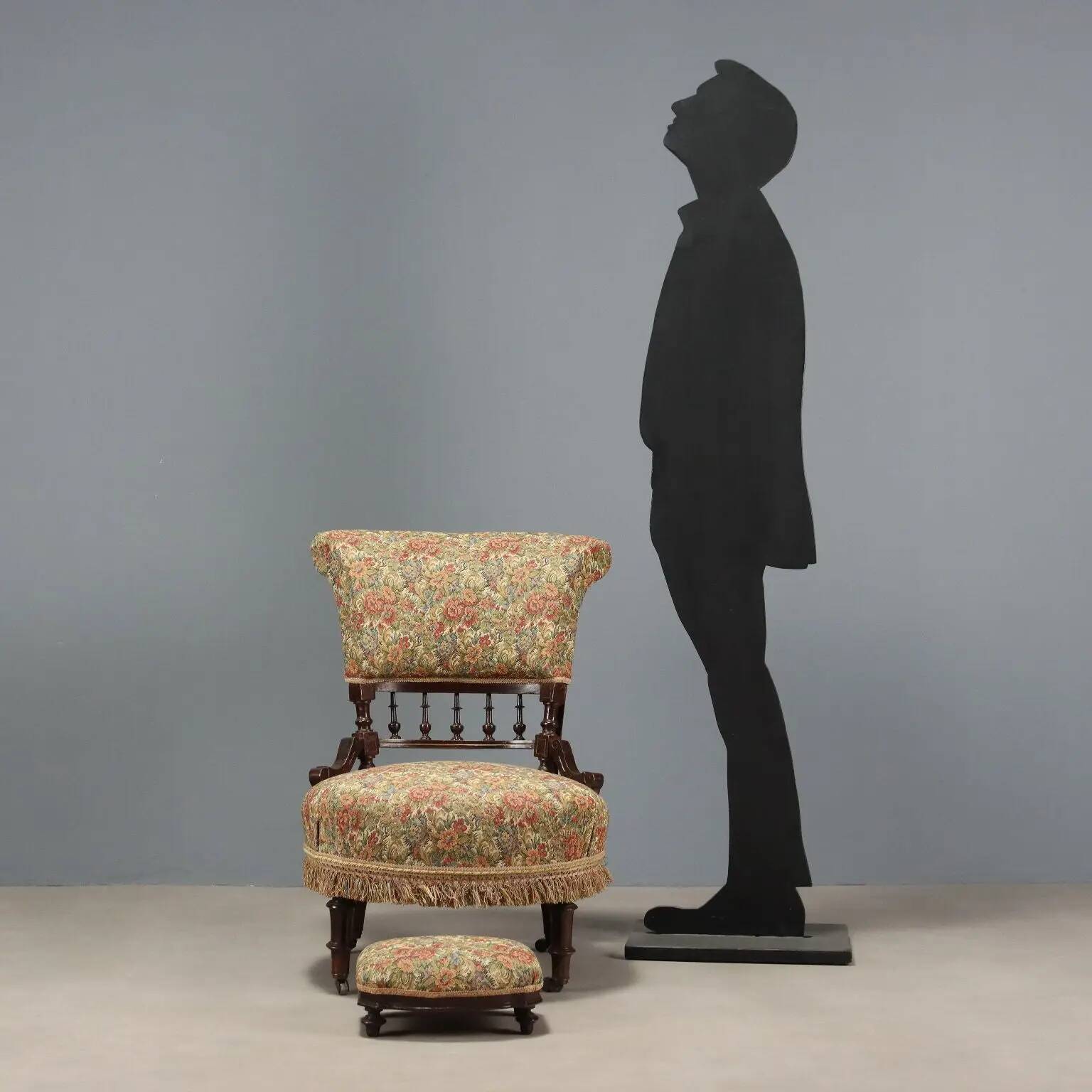 Victorian armchair with fabric pouf, England, 19th century.