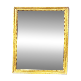 Ancien miroir au mercure en bois sculpté, doré à la feuille.
