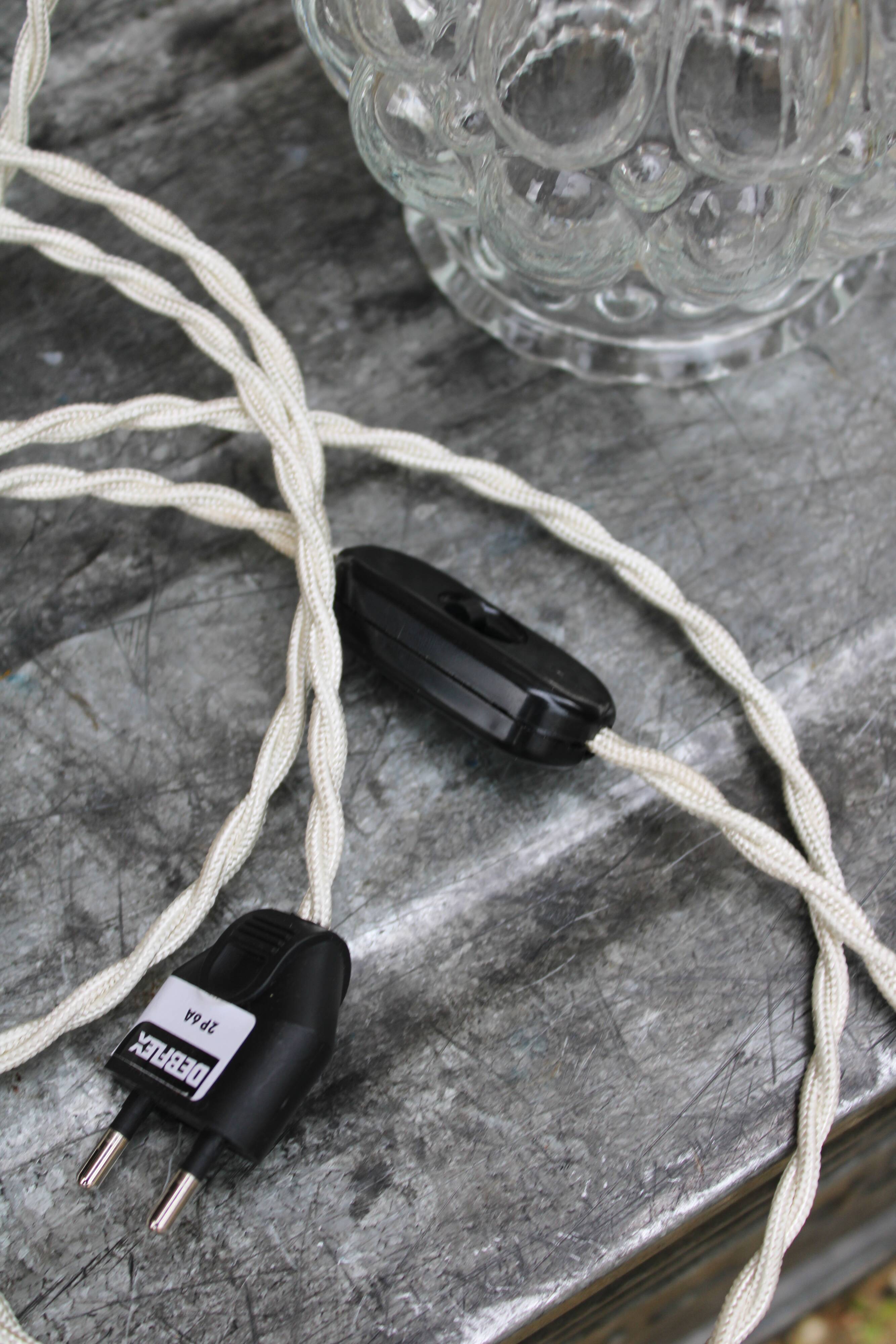 Moulded glass globe hand lamp